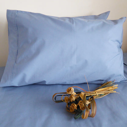 SleepFROG-Blue-pillowcase-on-bed-with-dried-woven-flowers
